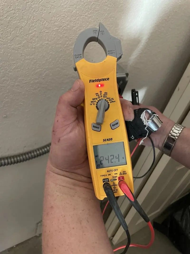 Voltage testing with clamp meter during Electrical Installation Services in Lakewood
